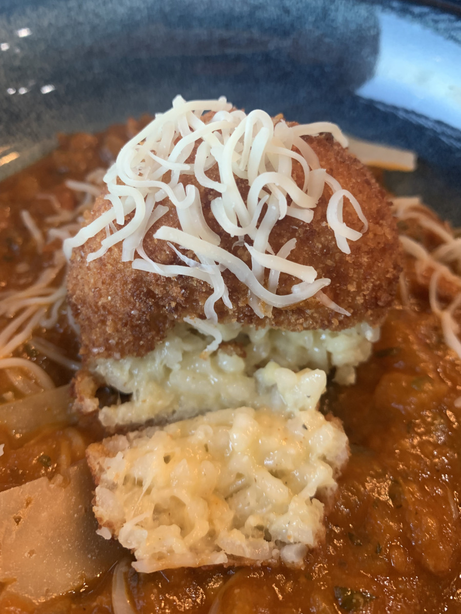 Arancini - Delicious fried balls of creamy Arborio rice and cheese.