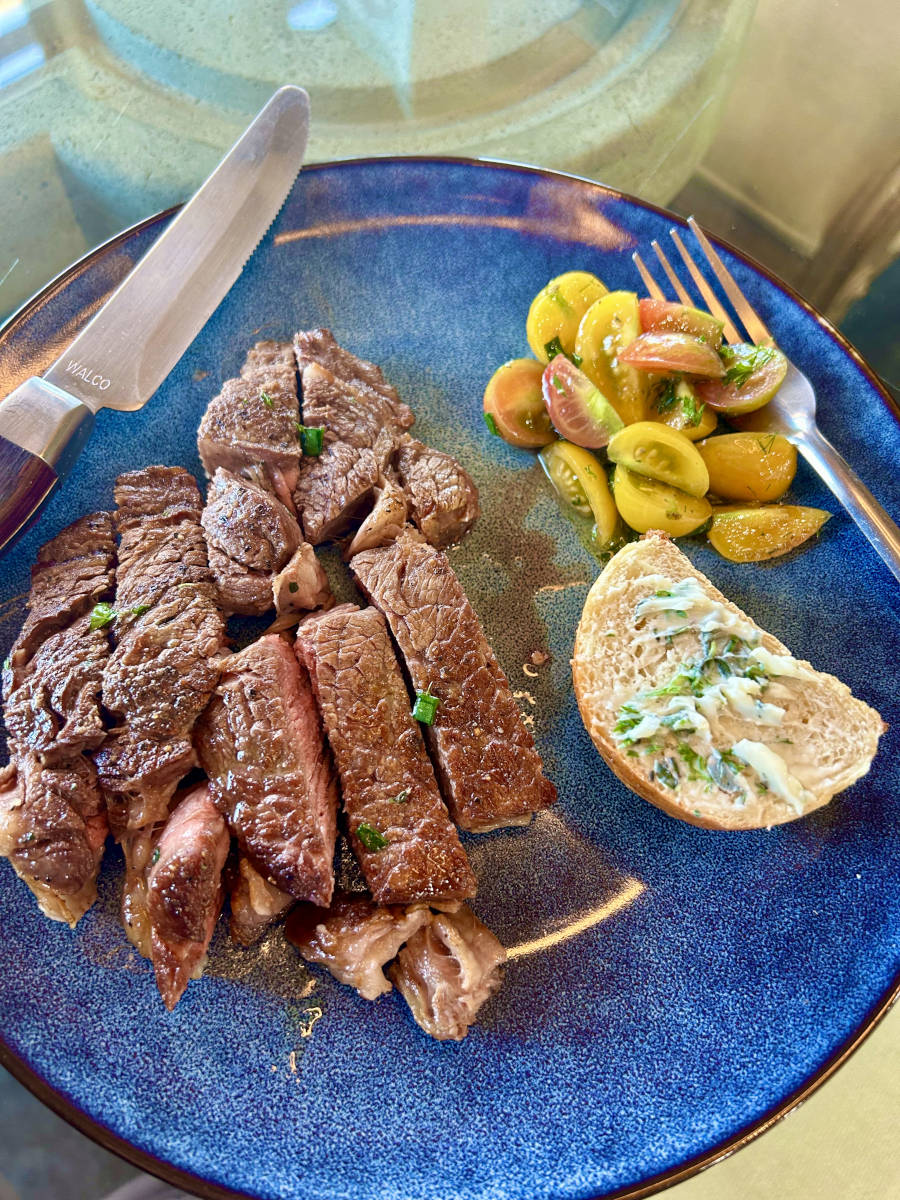 Skillet Ribeye - served with herb buttered French bread and tomato relish
