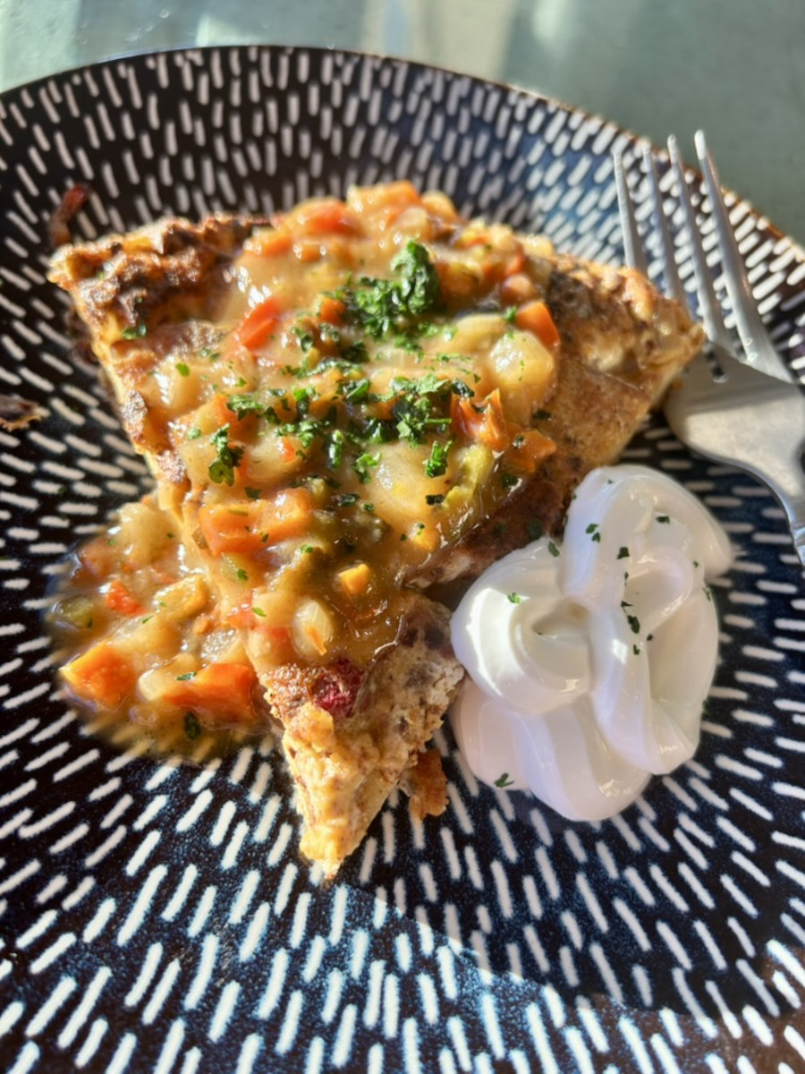 Spanish Omelette topped with salsa, cilantro, and a dollop of sour cream.